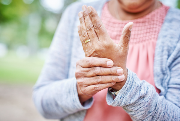 Person experiencing pain from osteoarthritis in their hand
